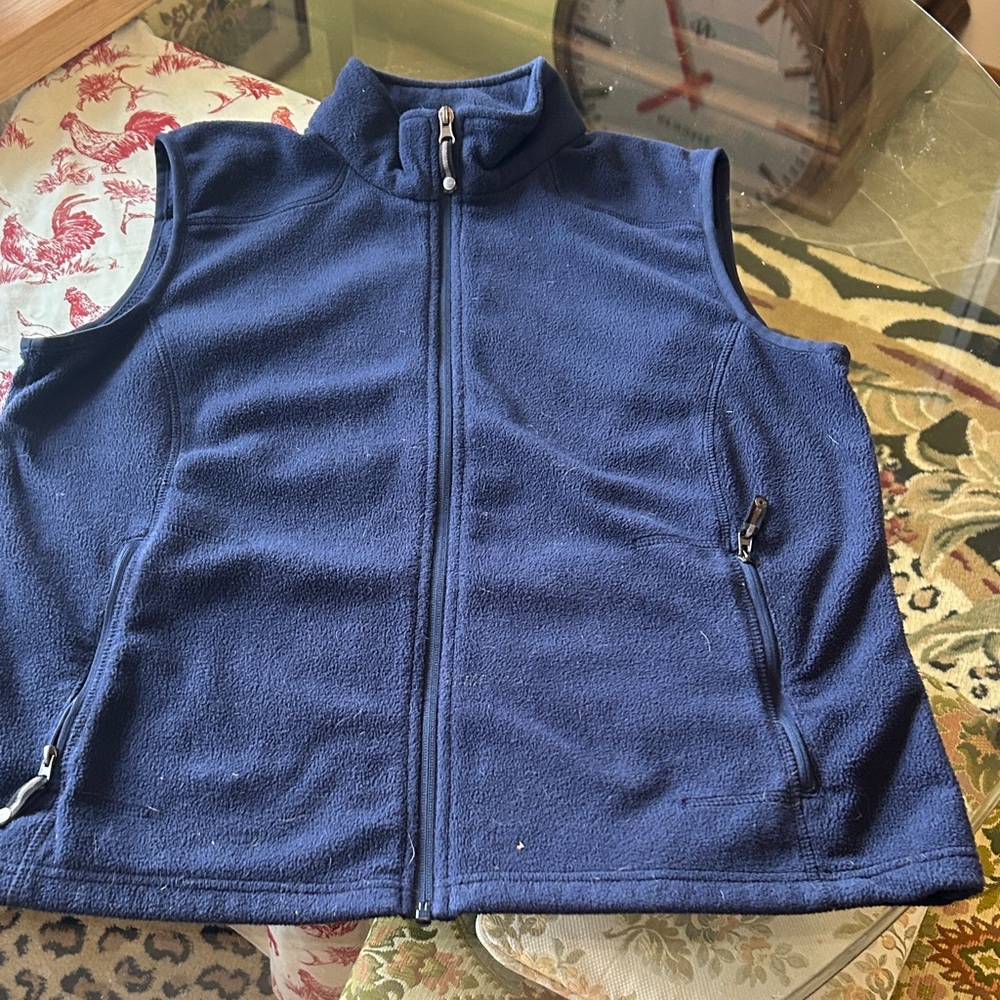 Cozy Navy Fleece Women's Vest great perks like inside pockets w/earphone feed!